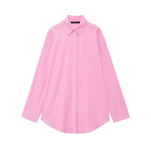 Detail of pink and white vertical striped shirt featuring a front pocket and classic collar