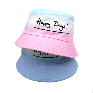 Kids gradient pink and blue bucket hat with Happy Days print and solid blue sun cap