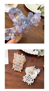 Detail view of flower hair claw clip with rhinestones and metal spring structure