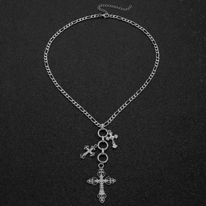 Detail of silver Figaro chain necklace featuring sparkling rhinestone cross pendants