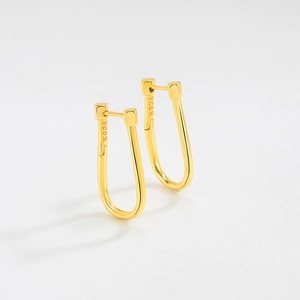 Detail showing S925 hallmark on polished gold U-shaped minimalist earrings
