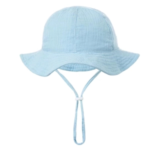 Detail of light blue cotton gauze baby sun hat with adjustable drawstring and wide brim
