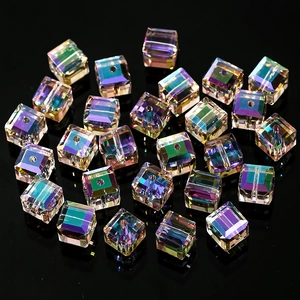 Macro shot of 4-8mm aurora AB cubic crystal glass beads with precision drill holes