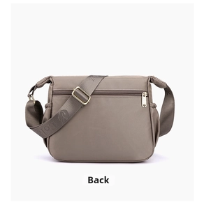 Rear view of waterproof nylon crossbody bag featuring a zippered pocket and wide strap