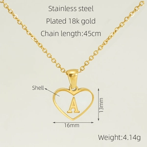 Macro detail of 18K gold plated stainless steel heart necklace with white shell inlay