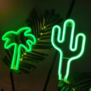 Neon palm tree and cactus lights in green glow for tropical holiday room decoration