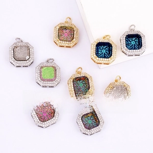 Detail of octagonal gold plated copper pendants with cubic zirconia and colorful stones