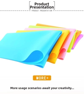 Detailed stack of multi-color silicone place mats in blue, green, and orange shades