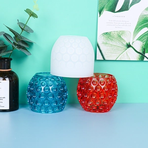 Close-up of colorful bubble texture resin molds and candle holders for home decor
