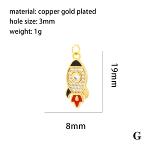 Detail view of 18K gold plated rocket pendant charm with dimensions and material info