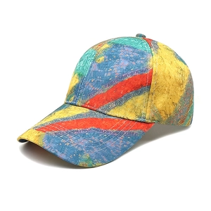 Detail shot of tie-dye baseball cap with colorful abstract art pattern and twill texture