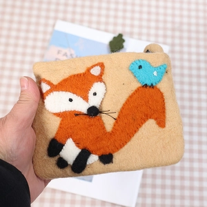 Handmade wool felt coin purse with cute orange fox and blue bird embroidery pattern