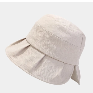 Foldable beige sun hat with wide brim and elegant bow design for summer beach outings