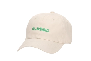 Close-up of green CLASSIC embroidery on off-white cotton twill baseball cap