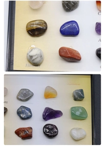 Detailed collection of polished natural crystal and mineral specimens in a display box