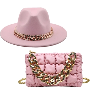 Pink wide brim fedora hat and matching quilted chain shoulder bag fashion accessory set