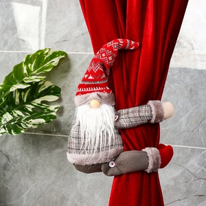 Close-up of a Christmas gnome curtain buckle with red plaid on a velvet drape