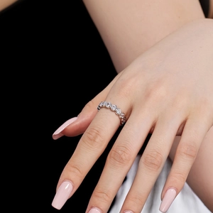 Close-up of S925 sterling silver heart geometric eternity ring with white pavé diamonds