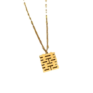 Minimalist gold titanium steel necklace with a Xi character pendant on a twisted chain