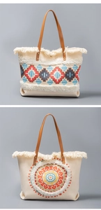 Detail of woven canvas tote bags with ethnic patterns, white fringes, and brown leather straps