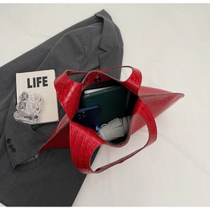 Top view of red crocodile texture tote bag showing spacious interior with daily essentials