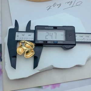 Detailed view of the oversized flower ring showing the 24.7mm diameter measurement