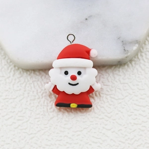 Detailed macro view of a red Santa Claus resin pendant with a silver metal loop for DIY