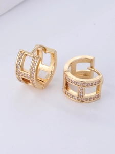 Detail of gold geometric hollow hoop earrings with sparkling paved zircon stones