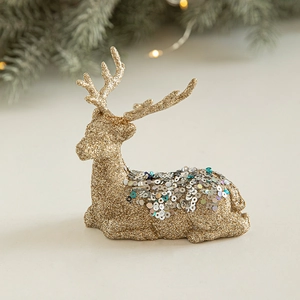 Elegant gold and silver glitter reindeer decoration for festive Christmas scene settings