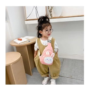 Pink rabbit cartoon chest bag for kids with adjustable strap worn by a young girl