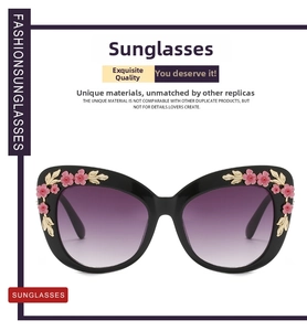 Detail of cat-eye sunglasses featuring intricate pink floral and golden leaf accents