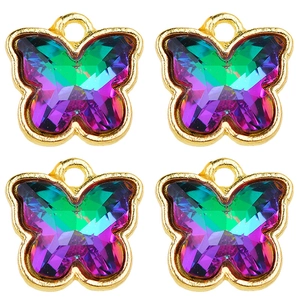 Close-up of four colorful crystal butterfly pendants with gold metal frames and hanging loops