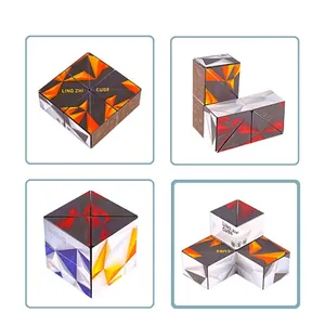 Macro shot of 3D geometric folding cube toys showing various patterns and flip shapes
