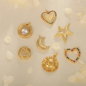 Detailed view of gold plated copper pendants with cubic zirconia for DIY jewelry making