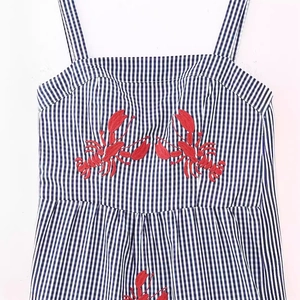 Blue and white gingham dress with red lobster embroidery on the bodice, front view