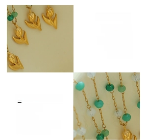 Detail of 18K gold plated titanium tulip pendant necklace with green crystal beads