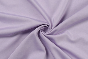 Macro shot of lavender ruched fabric showing fine diagonal weave and silky texture