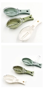Detail view of manual fish scaler with clear cover and ergonomic fish-shaped handle