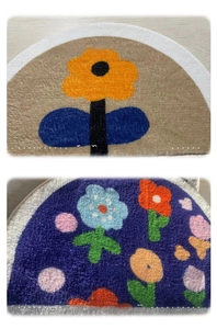 Close-up of high-density tufted floral semi-circle bath mats with thick plush texture
