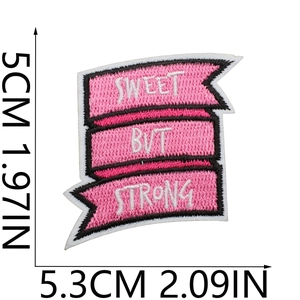 Macro shot of Sweet But Strong pink embroidered patch with 5x5.3cm size dimensions