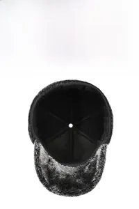 Detail view of winter hat showing thick grey faux fur lining and warm inner fabric