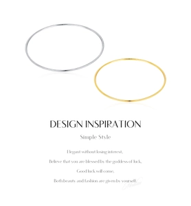 Detailed view of simple gold and silver S925 sterling silver bangles on white background