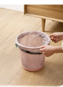 Pink hollow waste basket featuring an arc-shaped outer ring to fix trash bags easily