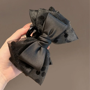 Elegant black satin bow hair claw with polka dot organza mesh layers for women