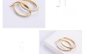 Detail of 18K gold plated oval hoop earrings with sparkling white rhinestones inlay