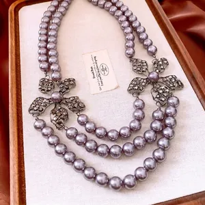 Double-layer purple pearl necklace with exquisite rhinestone hollow flower pendants