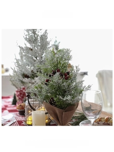 Mini artificial Christmas tree with red berries and burlap base for tabletop decor