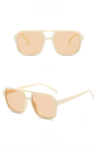 Detail view of cream square frame sunglasses with light brown lenses and double bridge