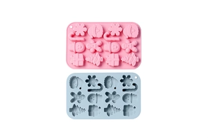 Flat lay of pink and blue silicone Christmas molds featuring snowman and gingerbread man