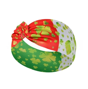 Detailed view of St. Patrick's Day knotted headband with clover and top hat print